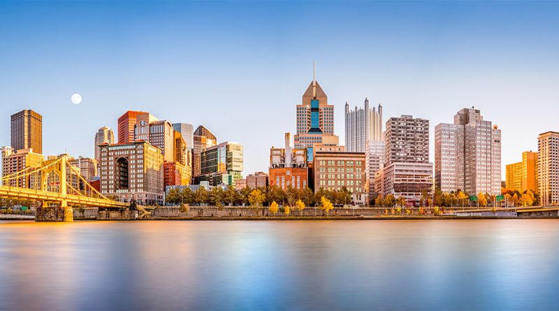 Long exposure of Pittsburgh downtown skyline and Roberto Clemente bridge, on a sunny afternoon, as viewed from North Shore Riverfront Park, across Allegheny River to support McKnight Road article